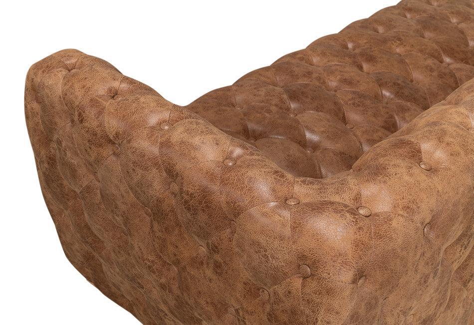 Divano in pelle trapuntata color marrone dorato