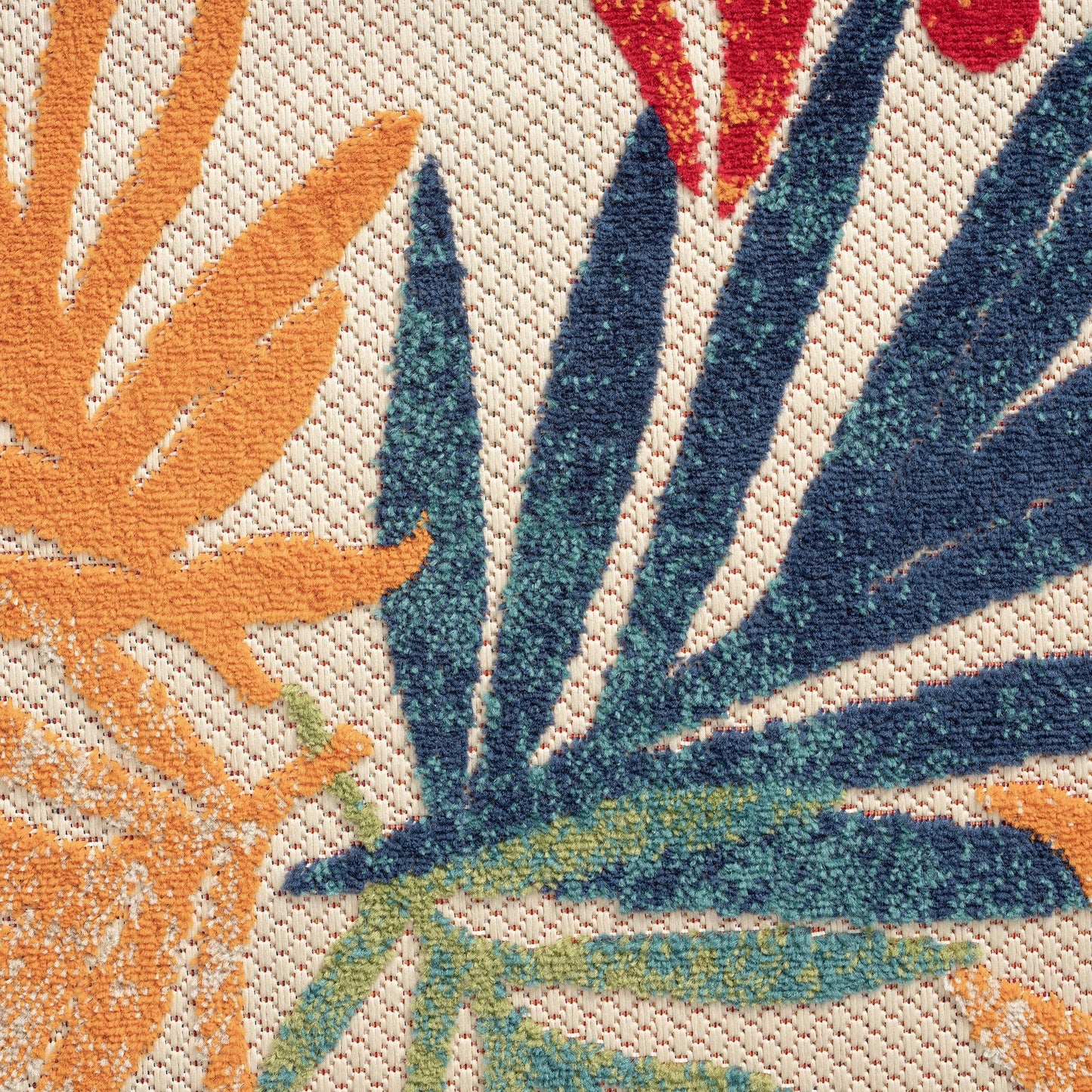 Tappeto da interno/esterno con motivo floreale costiero di origine.