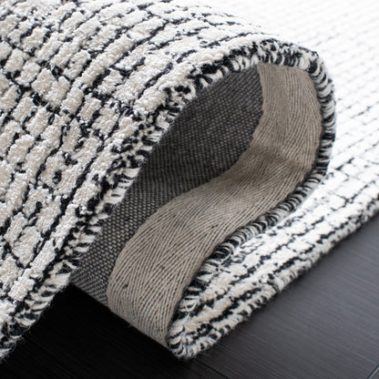 Tappeto moderno in viscosa Marikka astratto fatto a mano SAFAVIEH