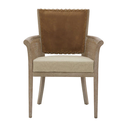 Poltrona con braccioli in canna e schienale in pelle cucita 