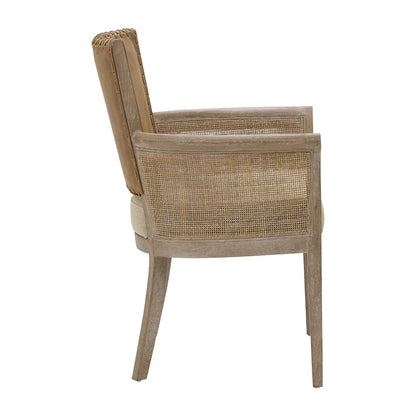 Poltrona con braccioli in canna e schienale in pelle cucita 