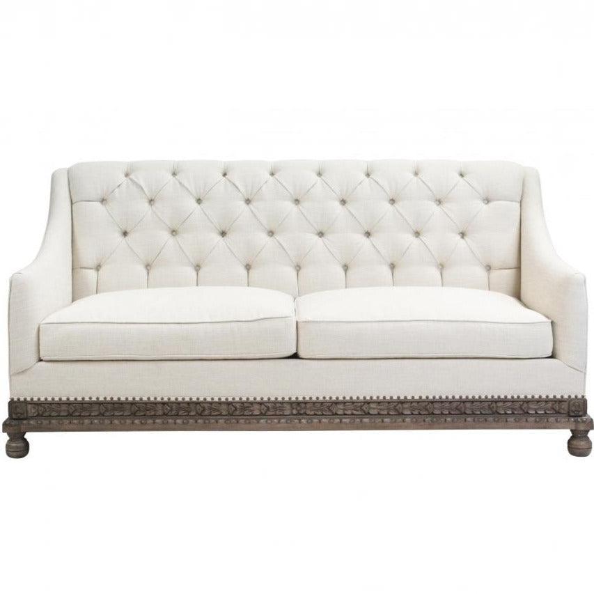 Divano con base in legno riccamente intagliato