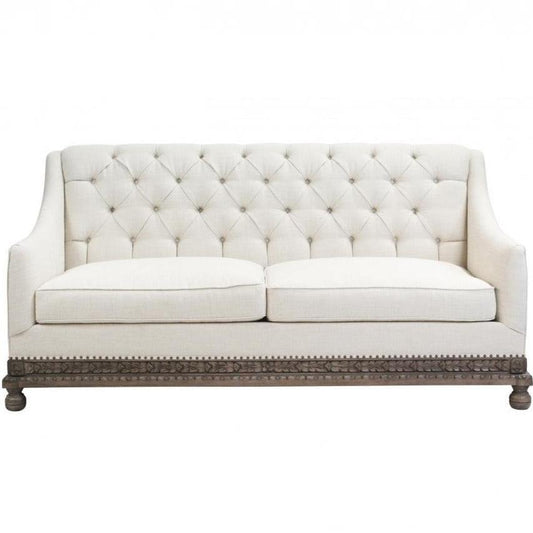 Divano con base in legno riccamente intagliato