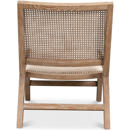 Poltrona con schienale in canna spazzato dal vento